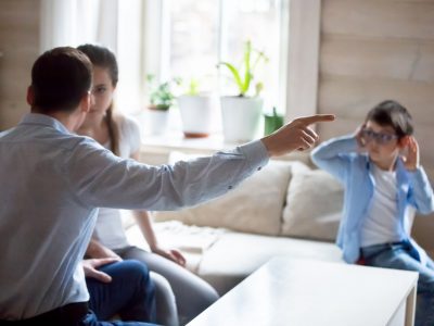 Parents argue at home in presence of small child, spouses have fight let little son hear dispute or quarrel, kid suffer from family conflict closing ears. Violence, break up affect children concept